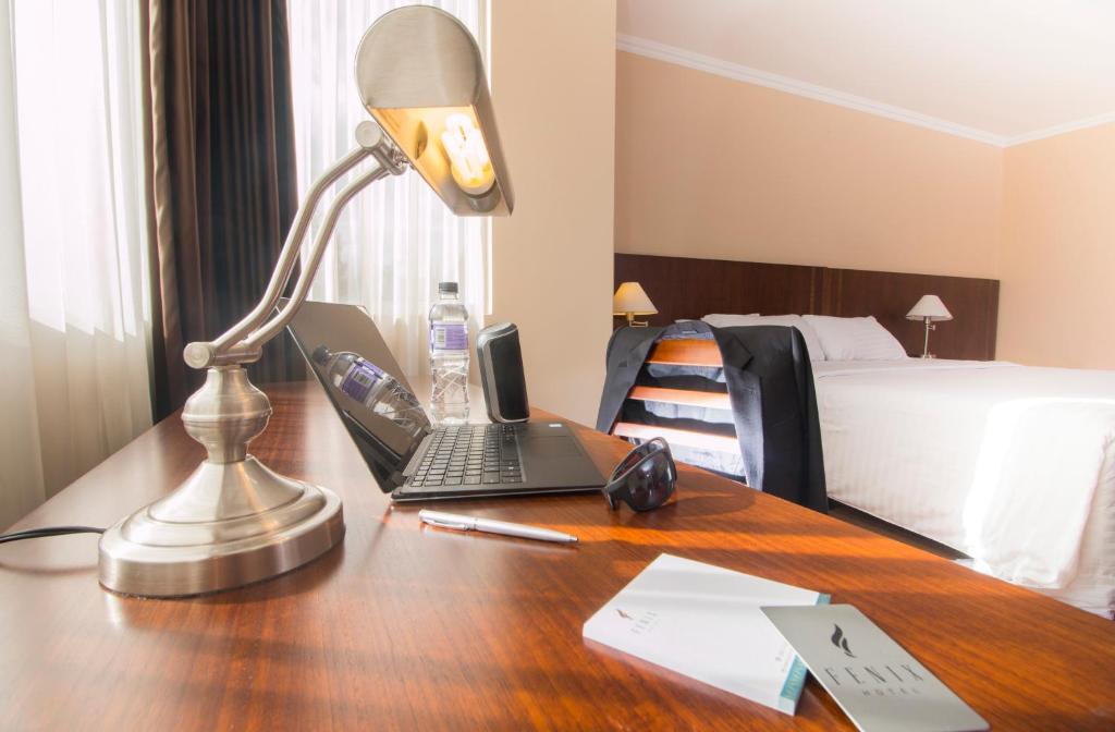 Postel nebo postele na pokoji v ubytování Fenix Hotel