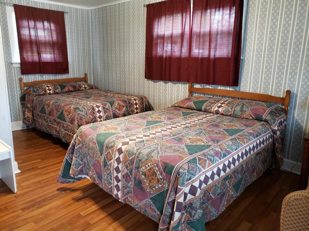 Postel nebo postele na pokoji v ubytování Regent Motel