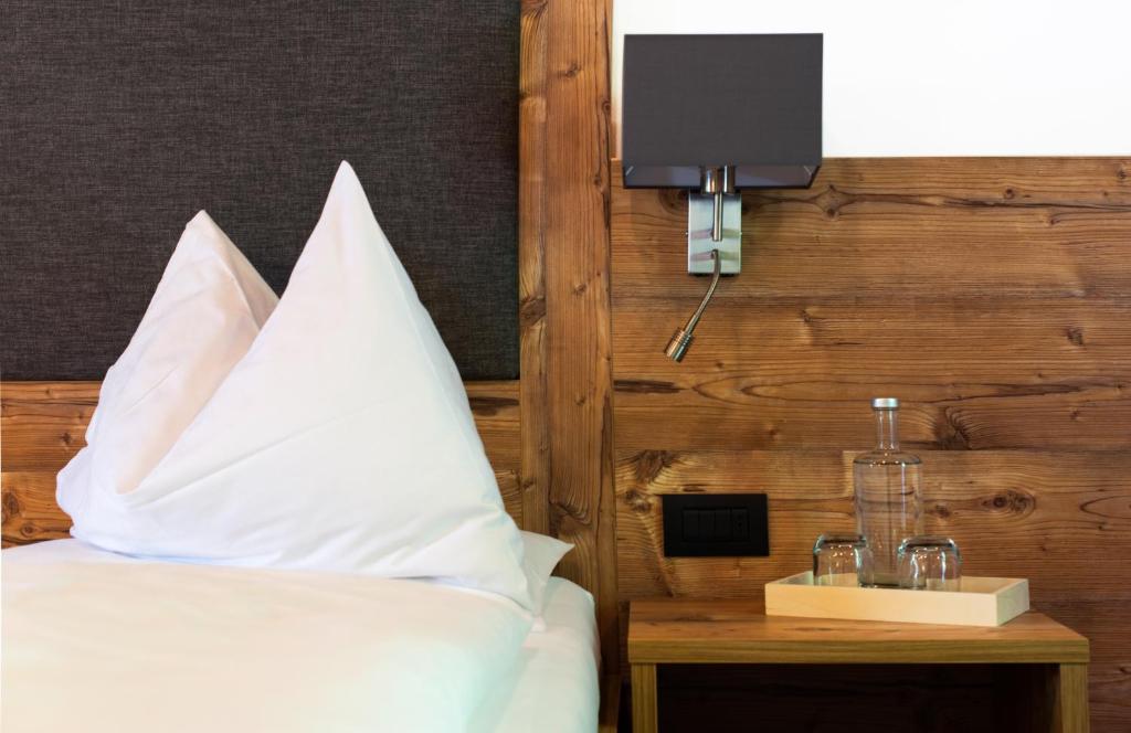 Postel nebo postele na pokoji v ubytování Charme Hotel Uridl