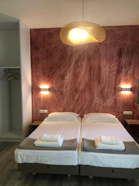 Postel nebo postele na pokoji v ubytování Villa Nena - Studio Suites