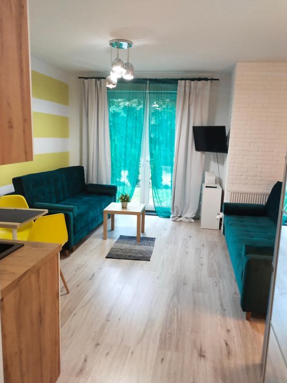 Televízia a/alebo spoločenská miestnosť v ubytovaní Lemon House