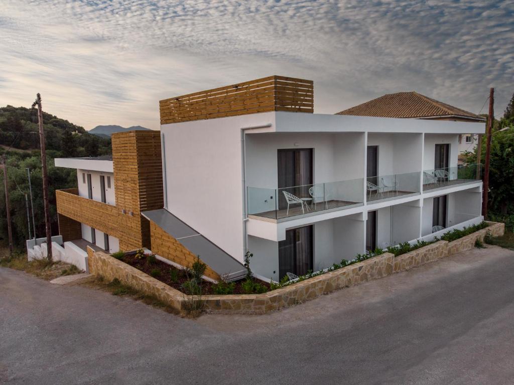 a rendering of a house with a balcony at Sigma Luxury Rooms in Syvota