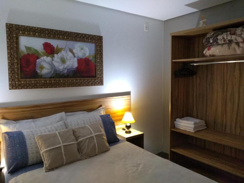 Postel nebo postele na pokoji v ubytování Residencial Franzen