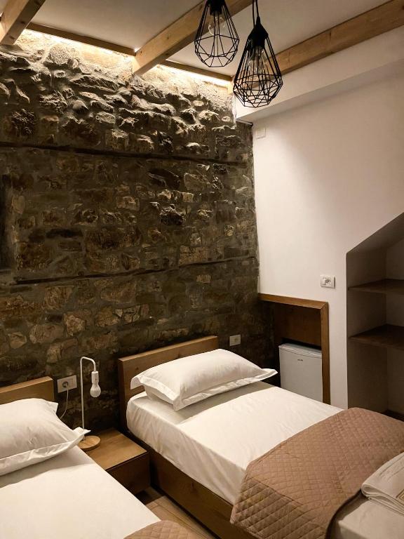 Ένα ή περισσότερα κρεβάτια σε δωμάτιο στο Amalia Hotel