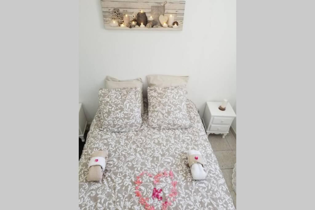 a bedroom with a bed with two stuffed animals on it at Calanques de Sormiou in Marseille