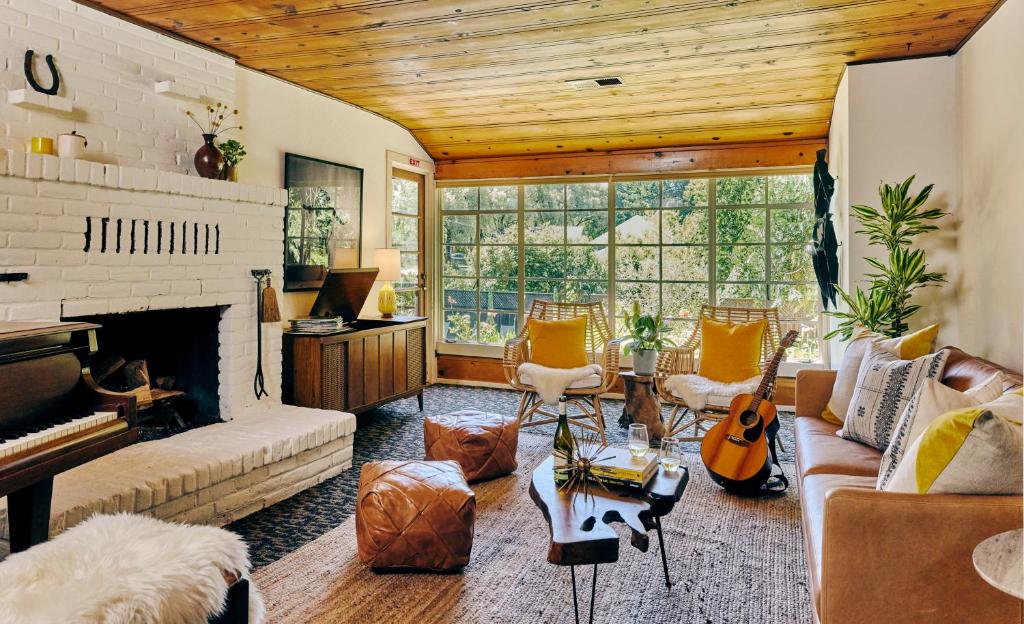 a living room with a couch and a fireplace at Highlands Resort in Guerneville