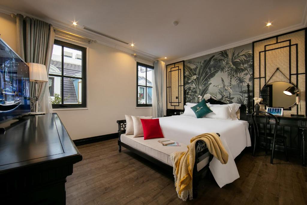 Ένα ή περισσότερα κρεβάτια σε δωμάτιο στο Green Suites Hotel