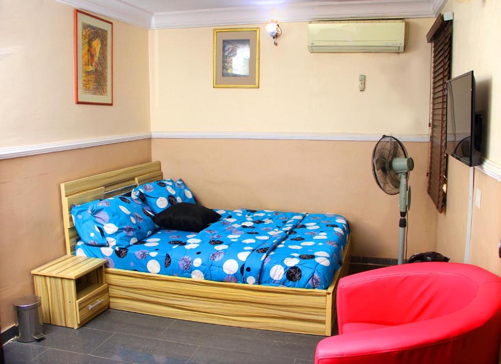 Postel nebo postele na pokoji v ubytování THOUCHI’S HOME
