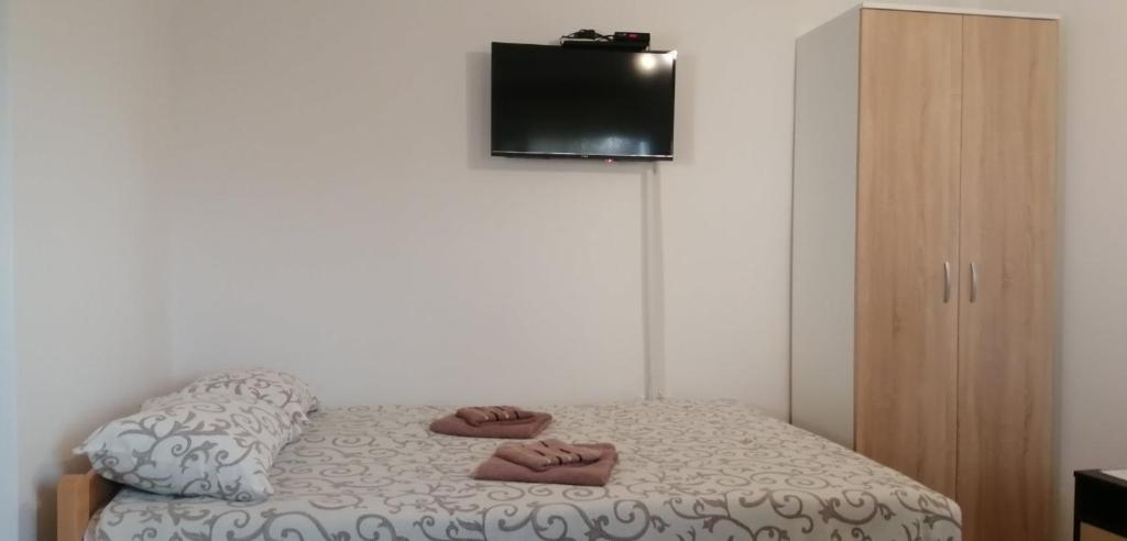Postel nebo postele na pokoji v ubytování Apartmani Ilić