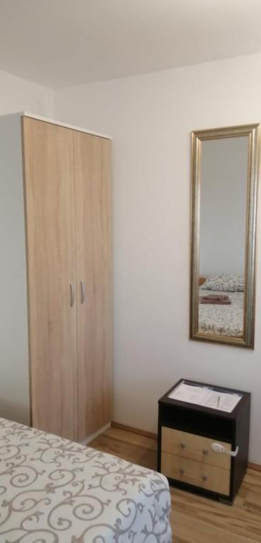 Postel nebo postele na pokoji v ubytování Apartmani Ilić