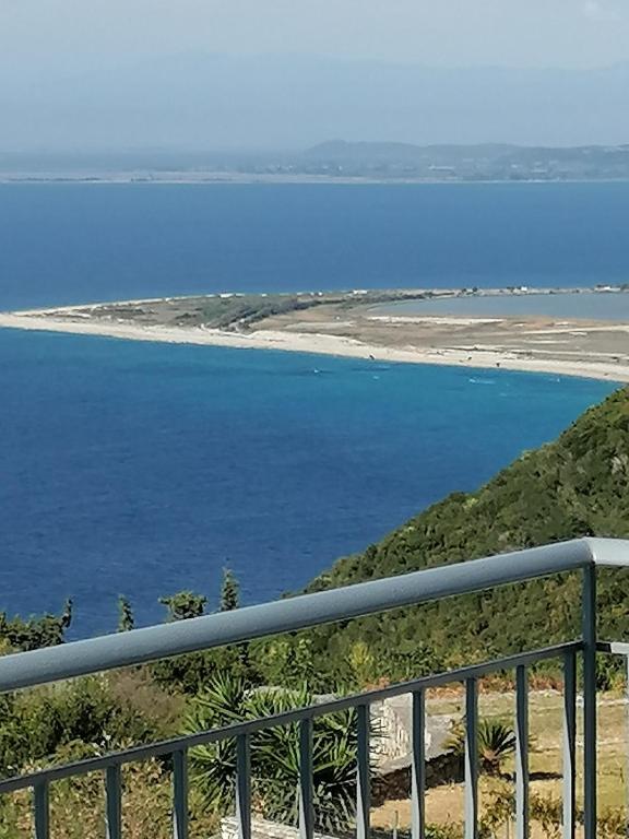 a view of the ocean from a balcony at Sea view apartments in Tsoukalades