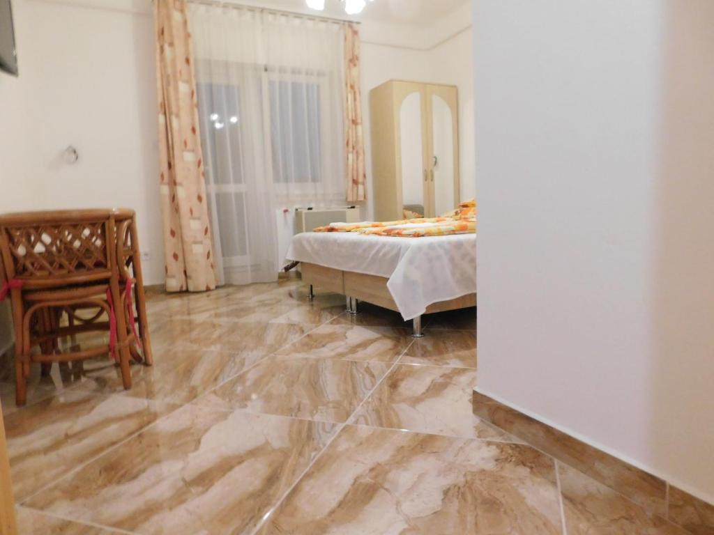 Postel nebo postele na pokoji v ubytování Szamóca Vendégház