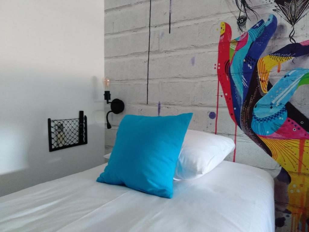Postel nebo postele na pokoji v ubytování Urban Style Arl HOTEL