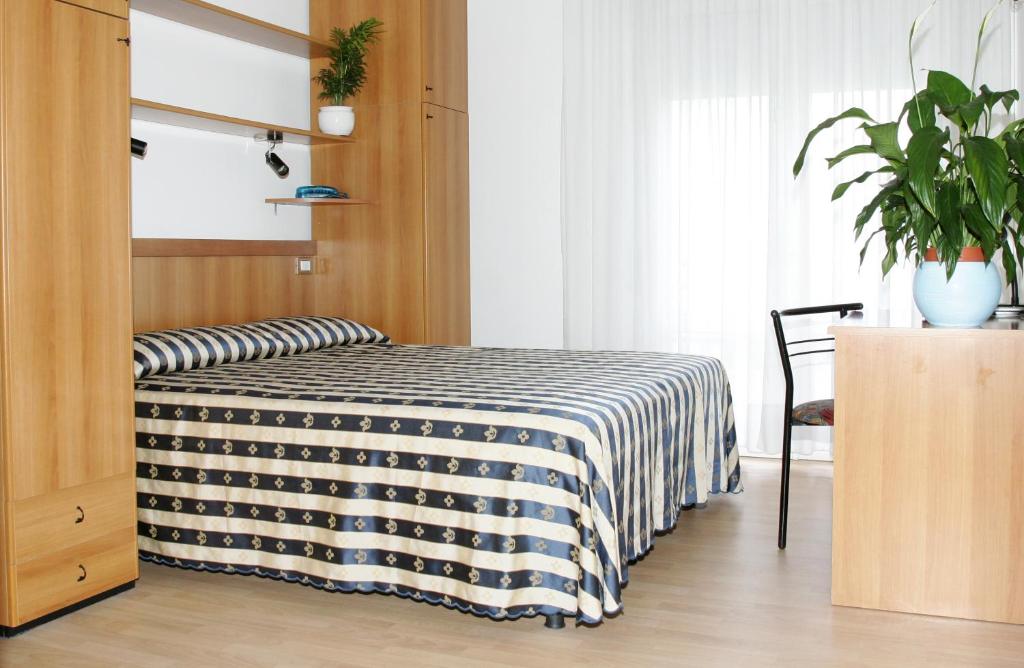 Postel nebo postele na pokoji v ubytování Hotel Arizona