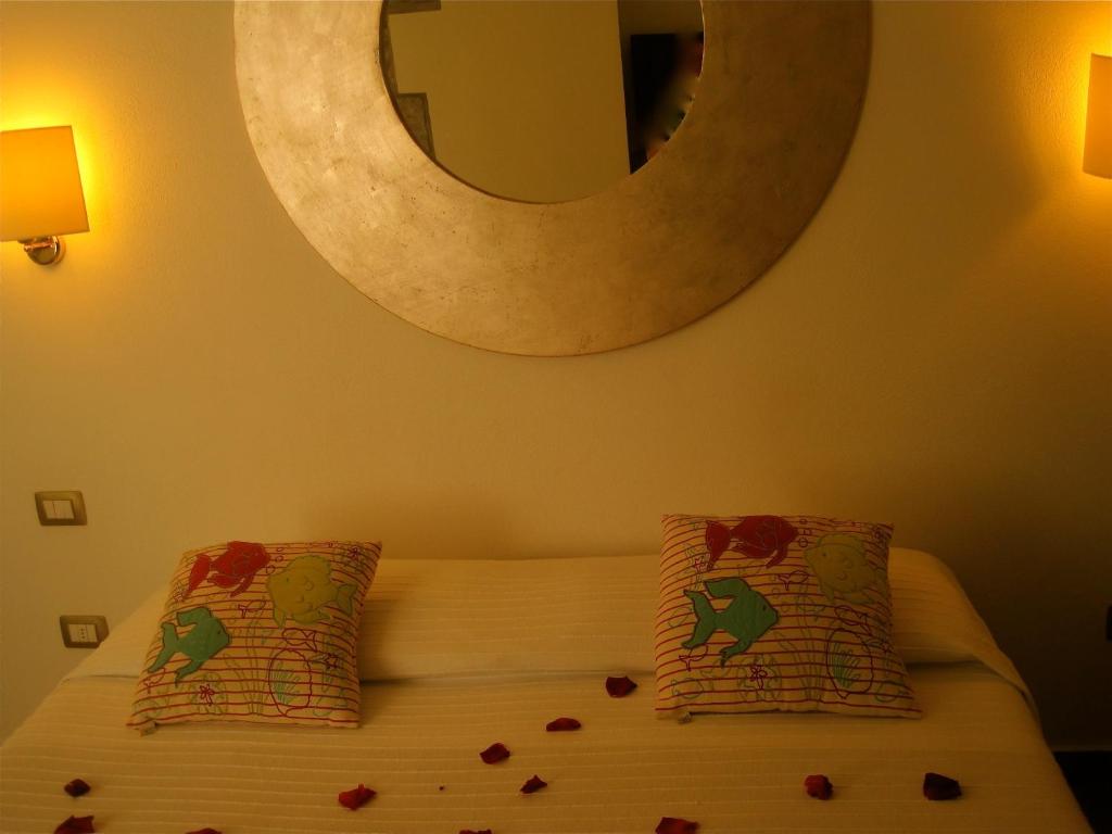 Postel nebo postele na pokoji v ubytování Hotel Villa Pimpina