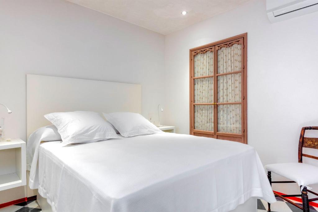 Posteľ alebo postele v izbe v ubytovaní Genteel Home Casa Alcázar