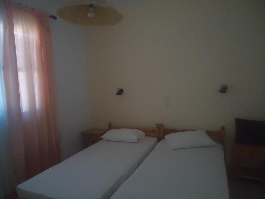 Postel nebo postele na pokoji v ubytování Balcony to Aegeon 1