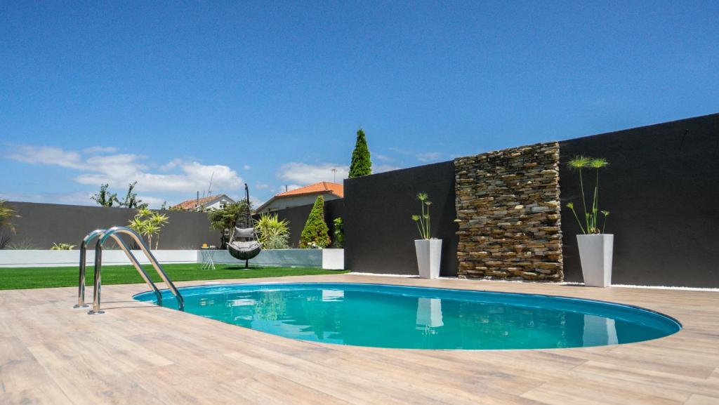 Bazén v ubytování Villa con piscina a pie de playa nebo v jeho okolí