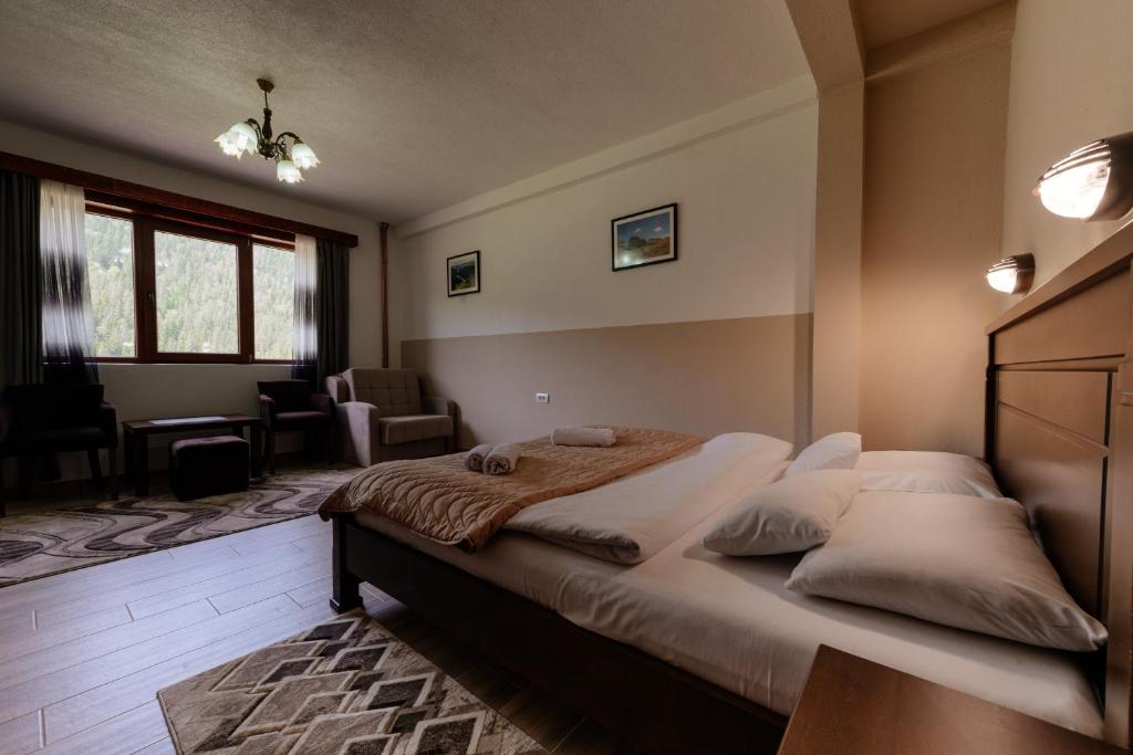 Postel nebo postele na pokoji v ubytování Etno selo Zminica