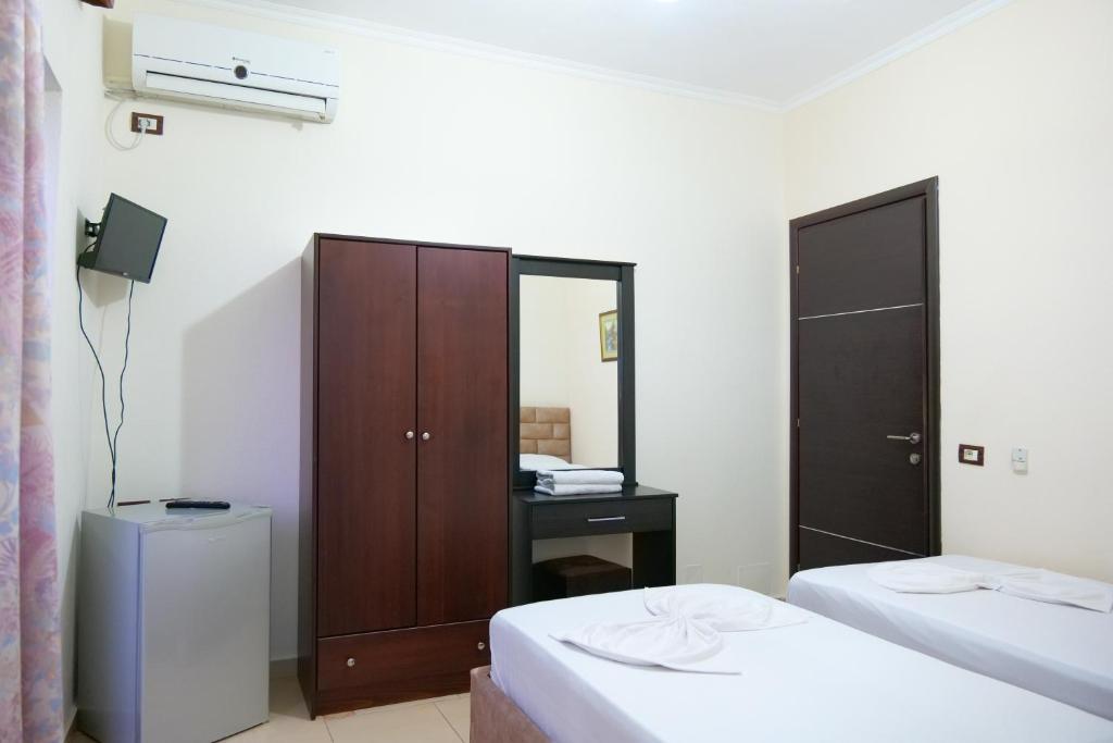 Postel nebo postele na pokoji v ubytování Hotel Rixhi