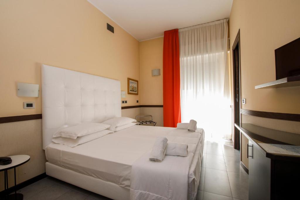 Postel nebo postele na pokoji v ubytování Hotel Derby