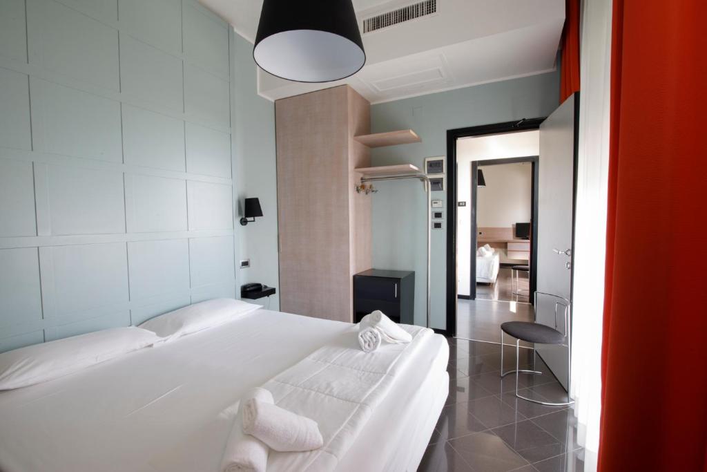 Postel nebo postele na pokoji v ubytování Hotel Derby