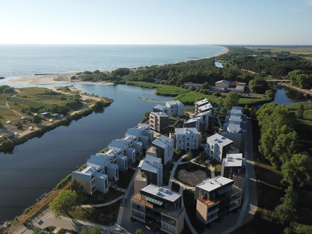 an aerial view of a river with buildings at Lighthouse Apartment Šventosios Vartai in Palanga