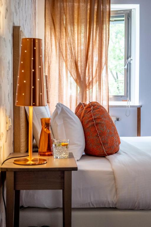 Postel nebo postele na pokoji v ubytování Villa Borgo Duino