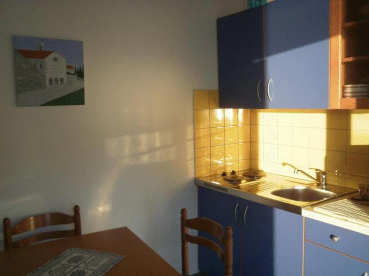 Kuchyň nebo kuchyňský kout v ubytování Apartments Mare More