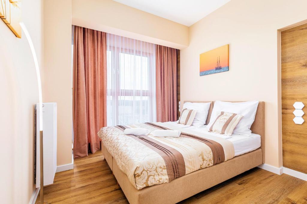 Posteľ alebo postele v izbe v ubytovaní Platan Tower Baltic & More Apartments