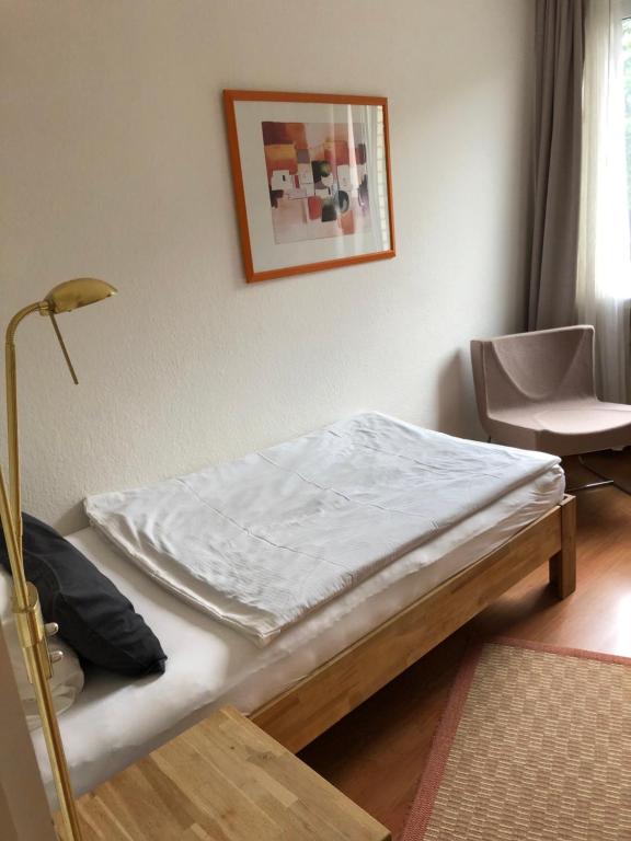 Ein Bett oder Betten in einem Zimmer der Unterkunft Paolos Seehotel Mardorf
