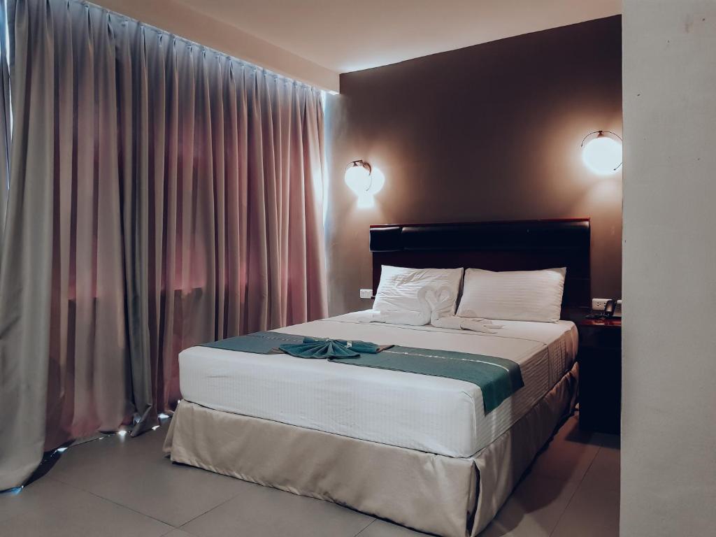 Postel nebo postele na pokoji v ubytování Dosi Hotel PH