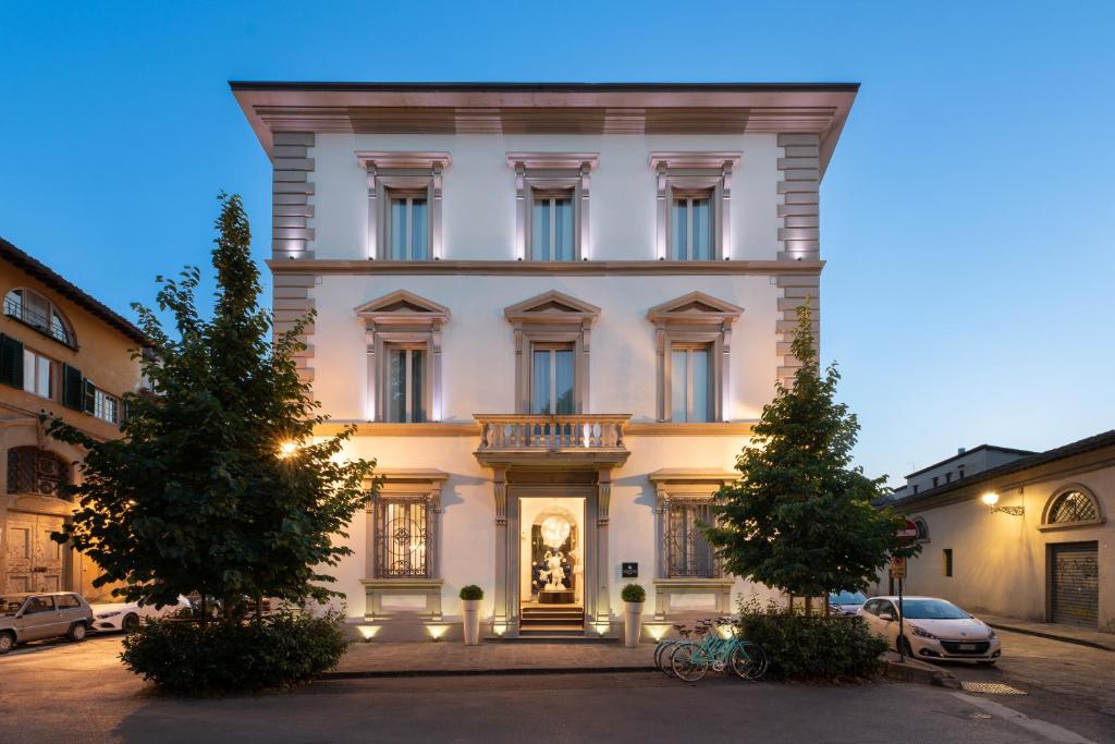 a large white building with trees in front of it at Eurostars Florence Boutique in Florence