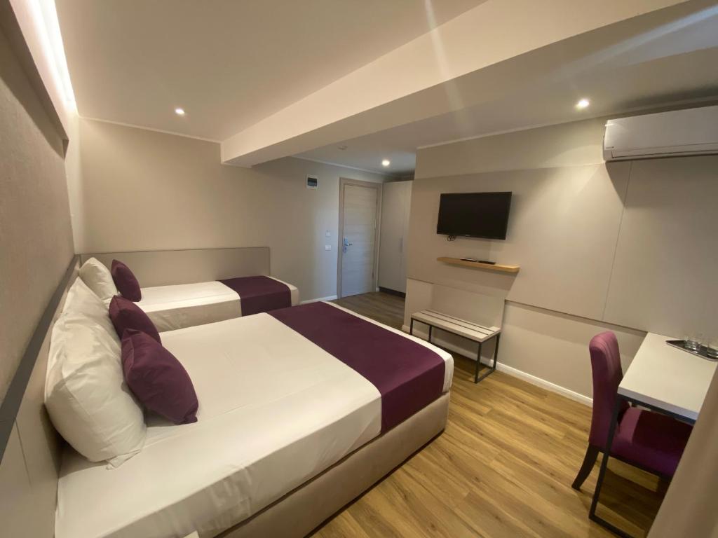 Postel nebo postele na pokoji v ubytování Hotel Rhodos