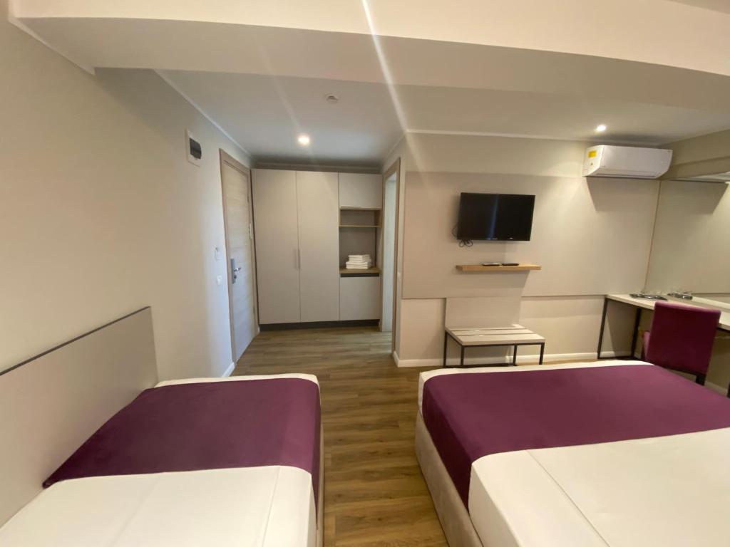 TV a/nebo společenská místnost v ubytování Hotel Rhodos