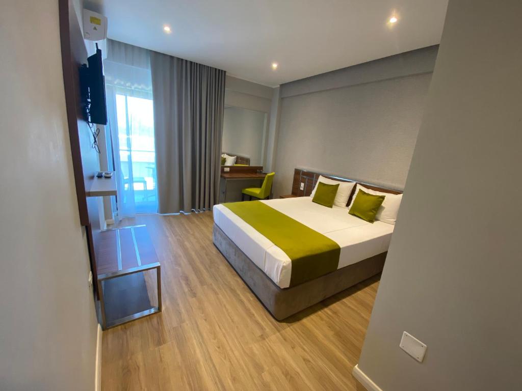 Postel nebo postele na pokoji v ubytování Hotel Rhodos