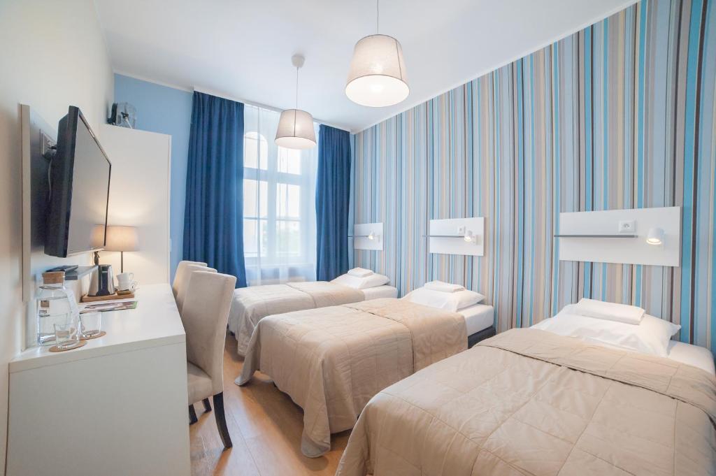 Posteľ alebo postele v izbe v ubytovaní Hotel Traffic Wrocław Stare Miasto