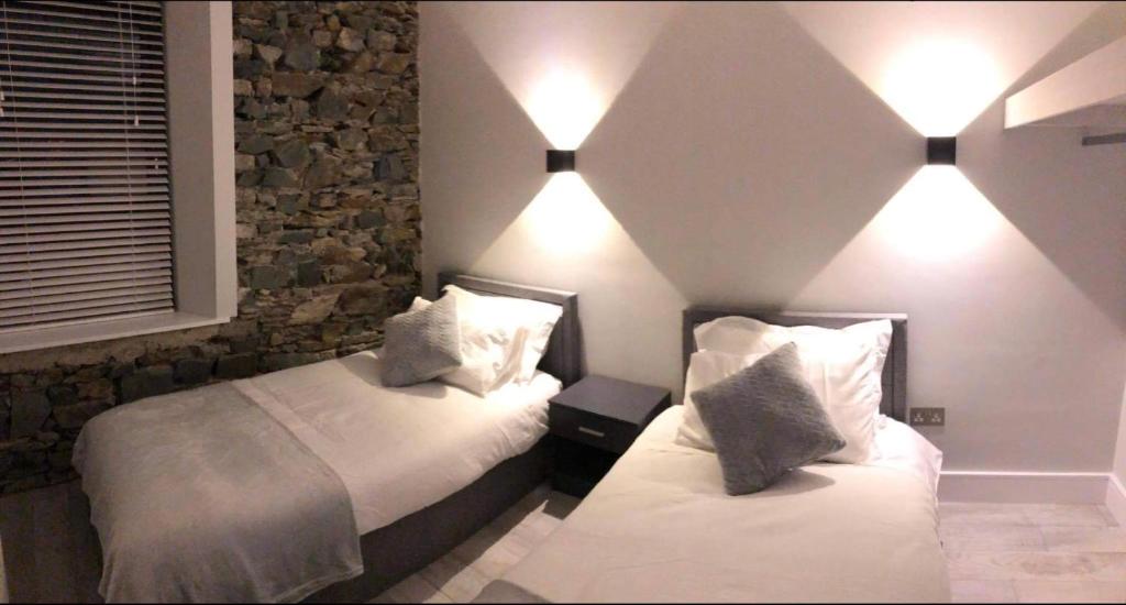 Postel nebo postele na pokoji v ubytování Lisvarna House