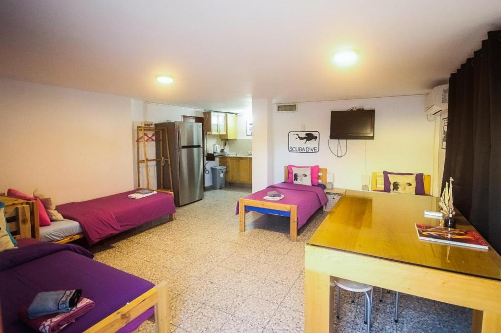 Llit o llits en una habitació de Exodus Hostel & Dive Center