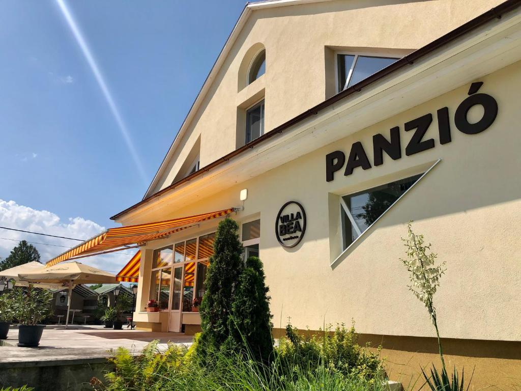 a building with the words panzco on it at Villa Bea Panzió in Zamárdi