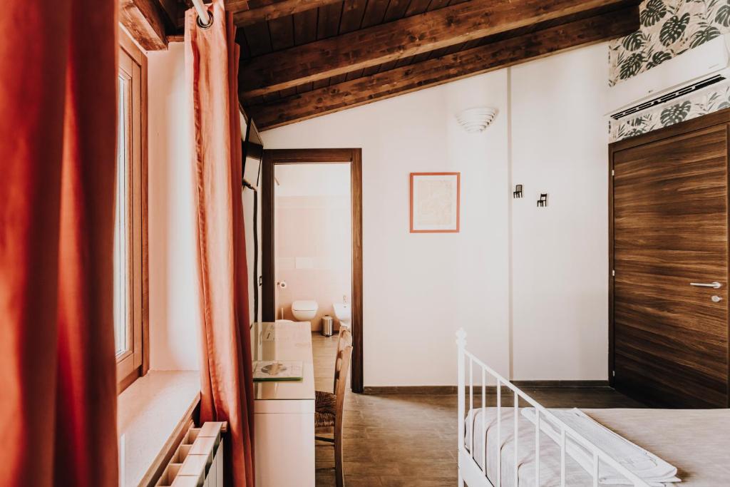 Postel nebo postele na pokoji v ubytování B&b La Cicala