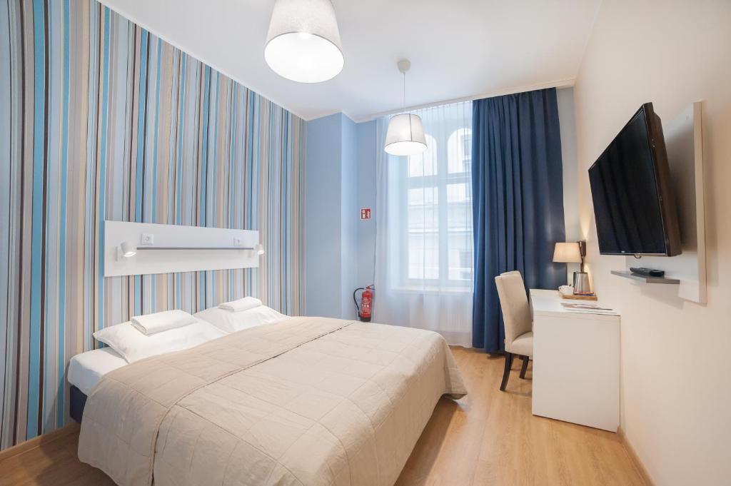 Posteľ alebo postele v izbe v ubytovaní Hotel Traffic Wrocław Stare Miasto