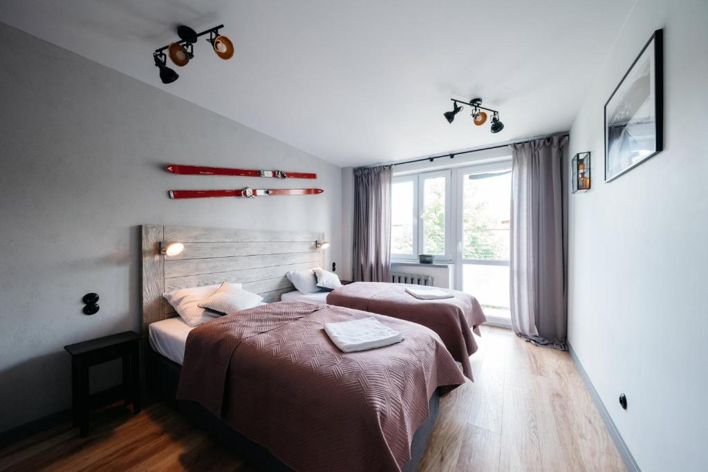 Łóżko lub łóżka w pokoju w obiekcie Szara Strefa - Loft Bieszczady Apartament