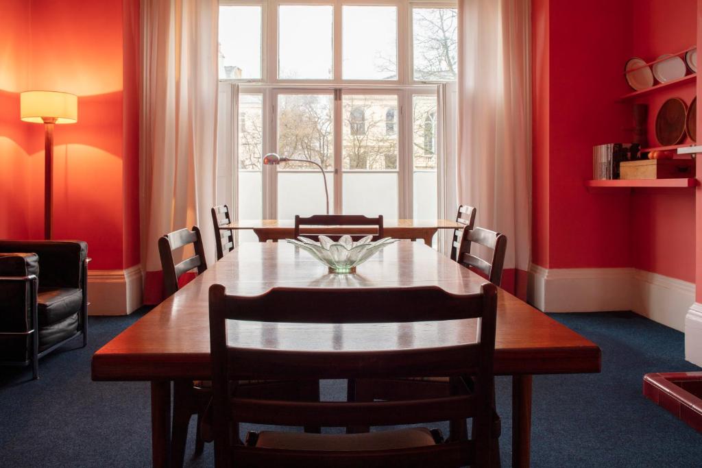 a dining room with a table and a window at Square Tree House in Liverpool