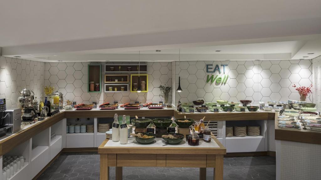a kitchen filled with lots of food on display at Holiday Inn Istanbul Old City by IHG in Istanbul
