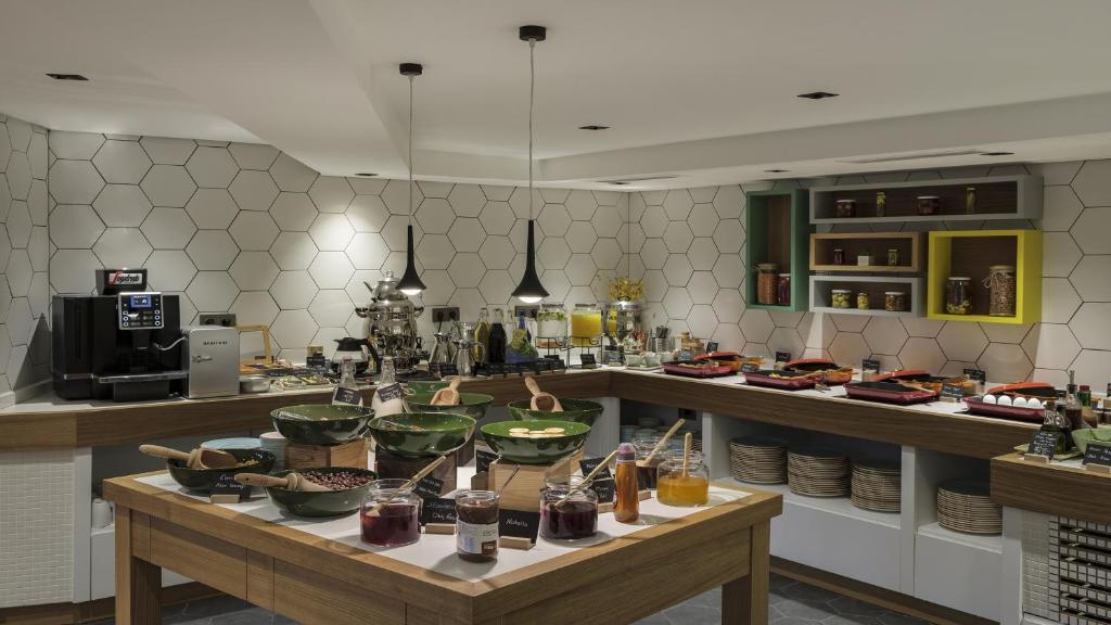 a kitchen with a table with food on it at Holiday Inn Istanbul Old City by IHG in Istanbul