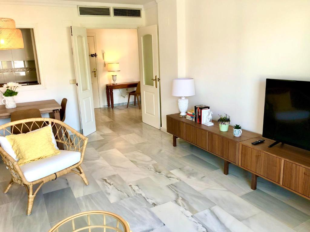 A television and/or entertainment centre at Inspiring Apartment in Carihuela Beach