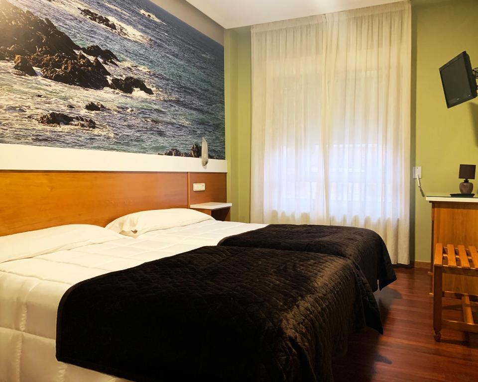 Postel nebo postele na pokoji v ubytování Hotel Bello