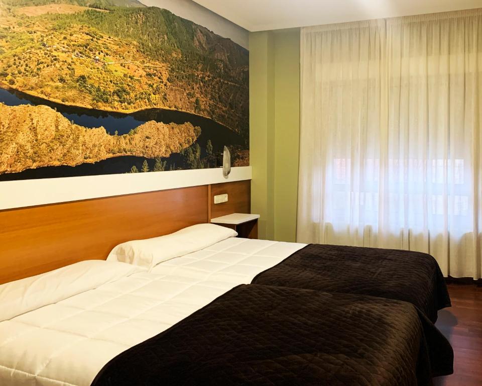 Postel nebo postele na pokoji v ubytování Hotel Bello