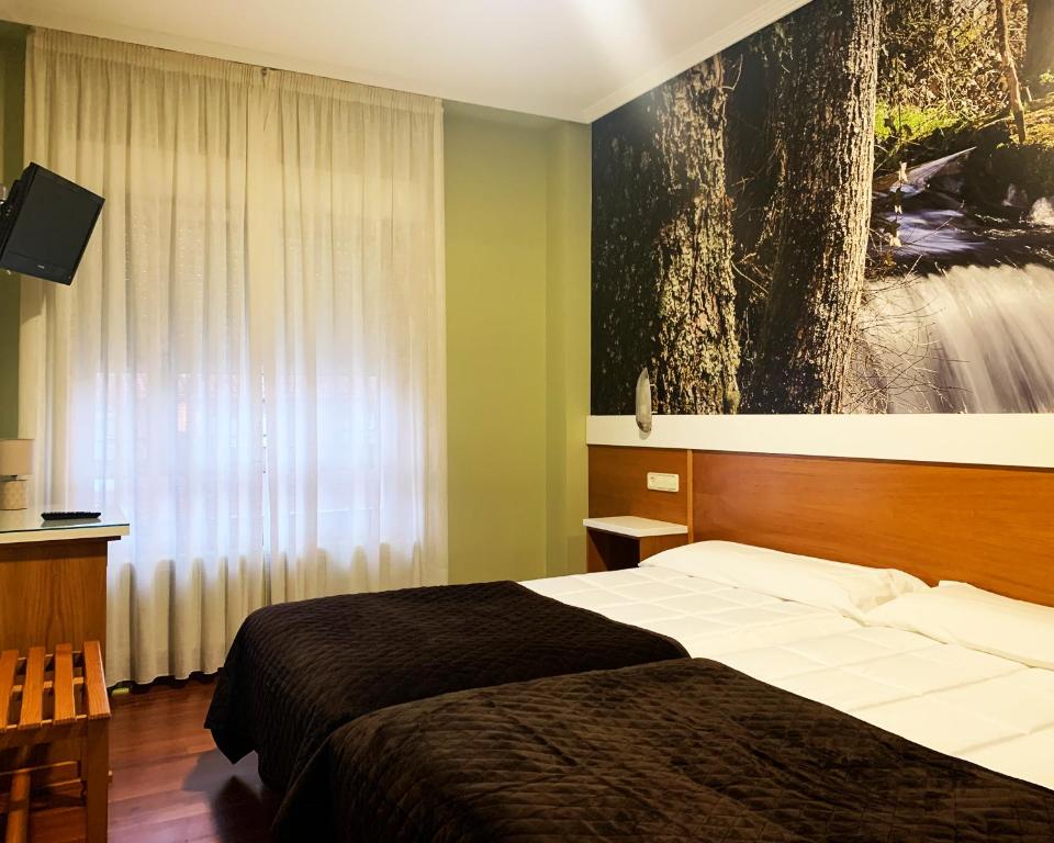 Postel nebo postele na pokoji v ubytování Hotel Bello